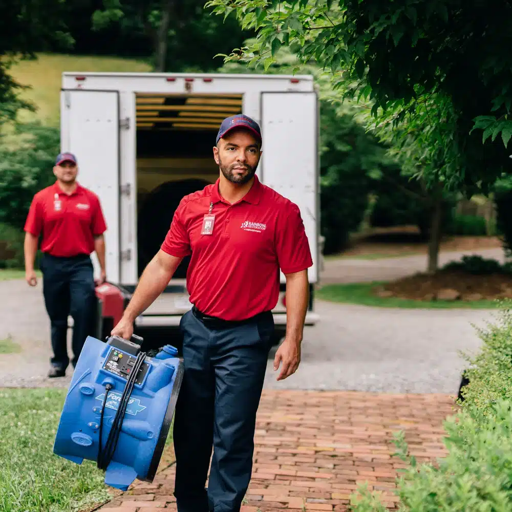 Rainbow Restoration technicians arriving with drying equipment for residential water damage restoration