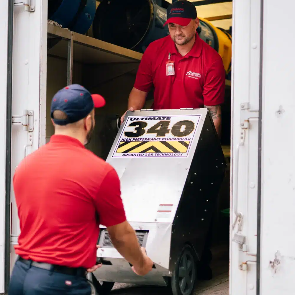 Rainbow Restoration technicians unloading drying equipment for residential and commercial restoration services