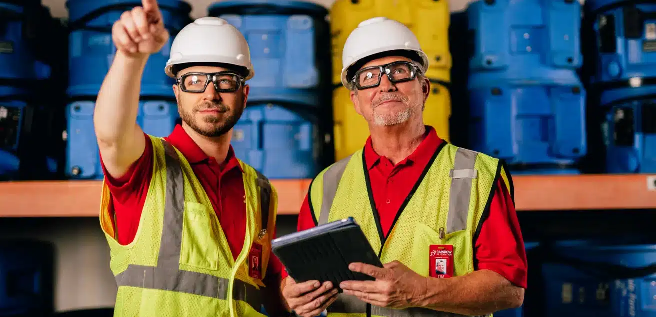 Rainbow Restoration technicians inspecting damage restoration equipment