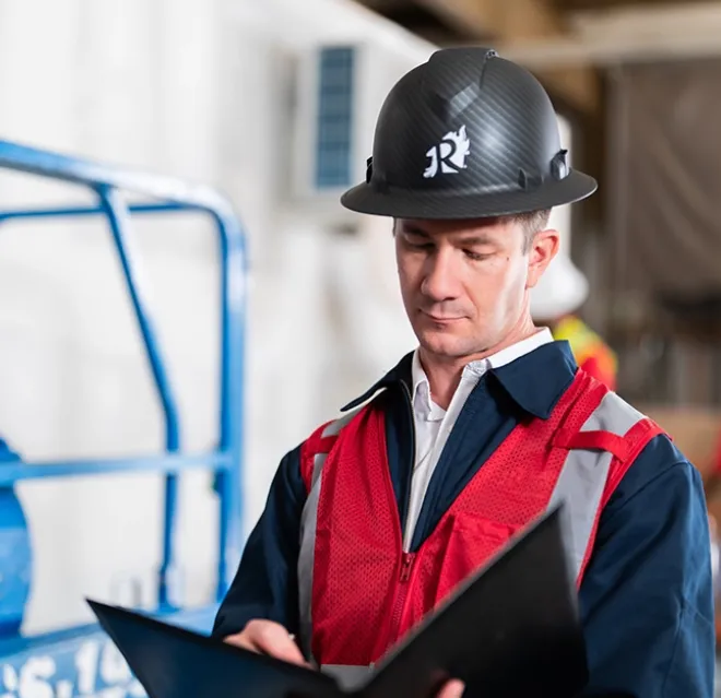 A Rainbow Restoration team member reviews job documentation while on site at a commercial disaster restoration job in Okatie, SC.