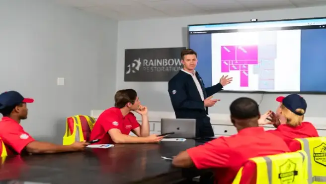 The client discussing with the workers.