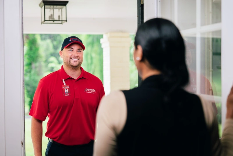 Rainbow Restoration professional greeting a customer.