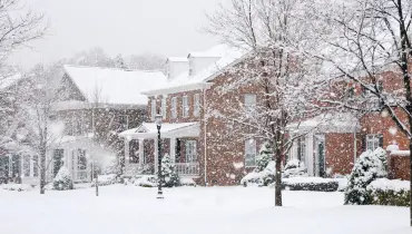 Houses during a snowstorm.
