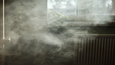 Cigarette smoke lingering indoors.