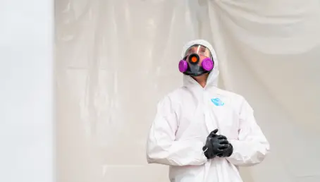 Rainbow Restoration professional examining mold.