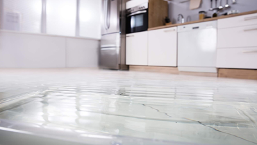 A flooded kitchen in a St. Louis home suffering from water damage.